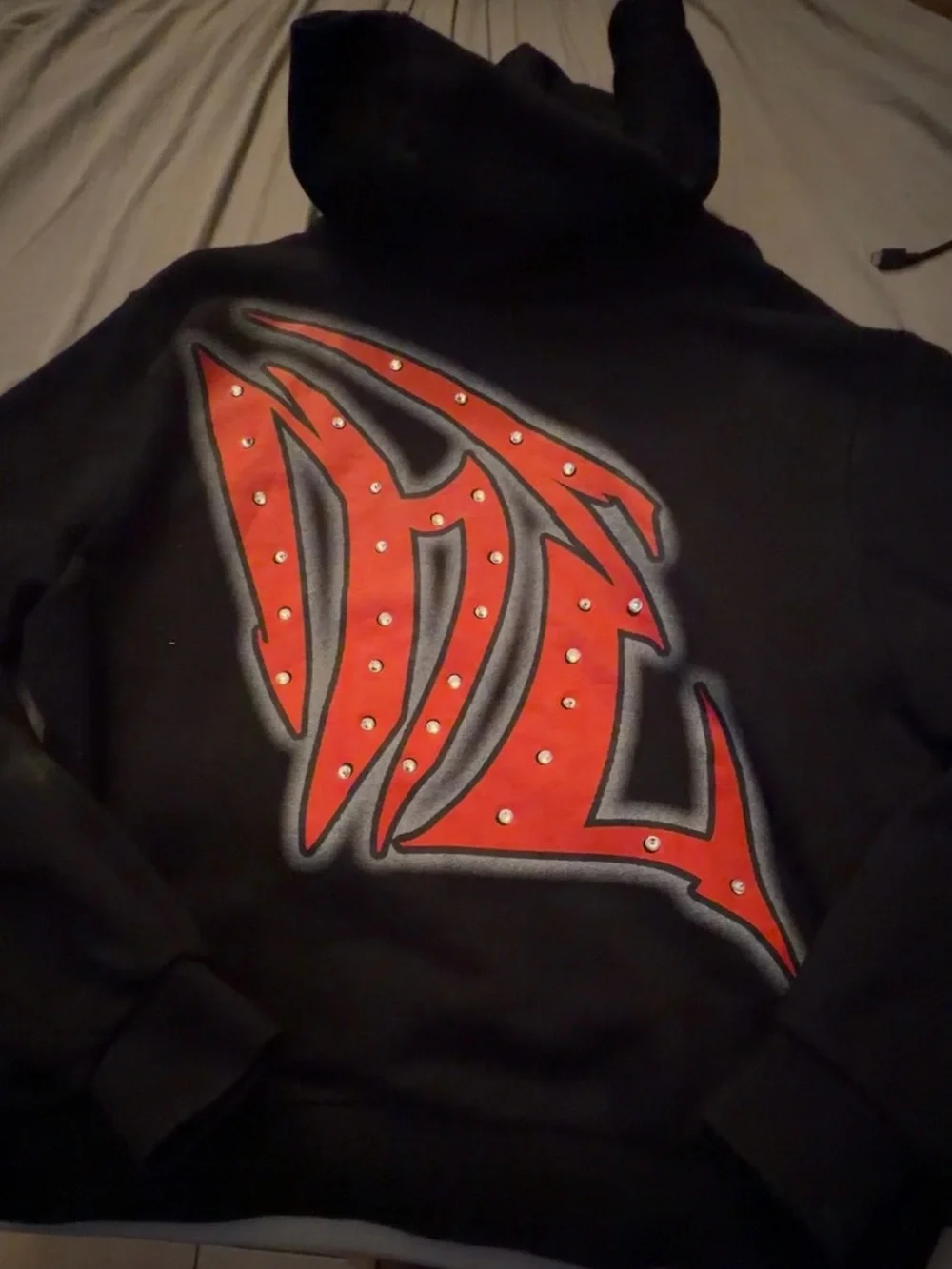 Mixed Emotions Black Zip-Up Hoodie with Red Studded Graphic